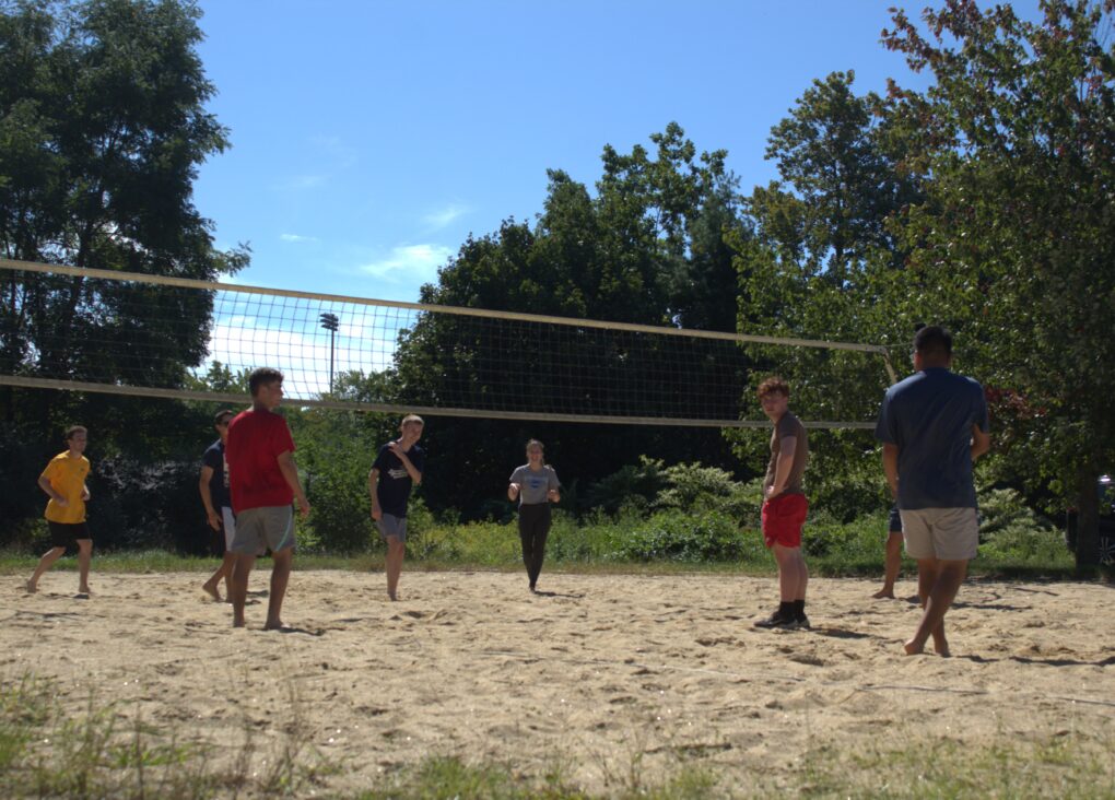 students playing volleyball