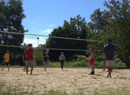 students playing volleyball