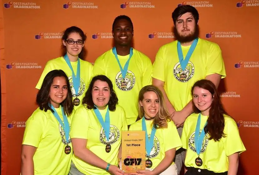 SNHUs Destination Imagination team displaying their newly-won first place medals.