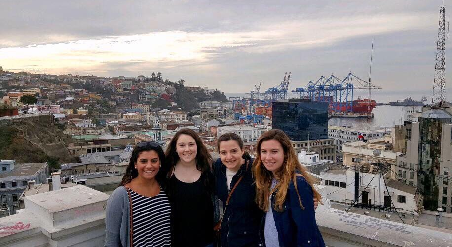 Caption: Left to right: Brianna Camara, Kathryn Limerick, Ashley Lindsey and Allie Either stand on a balcony overlooking Chile.