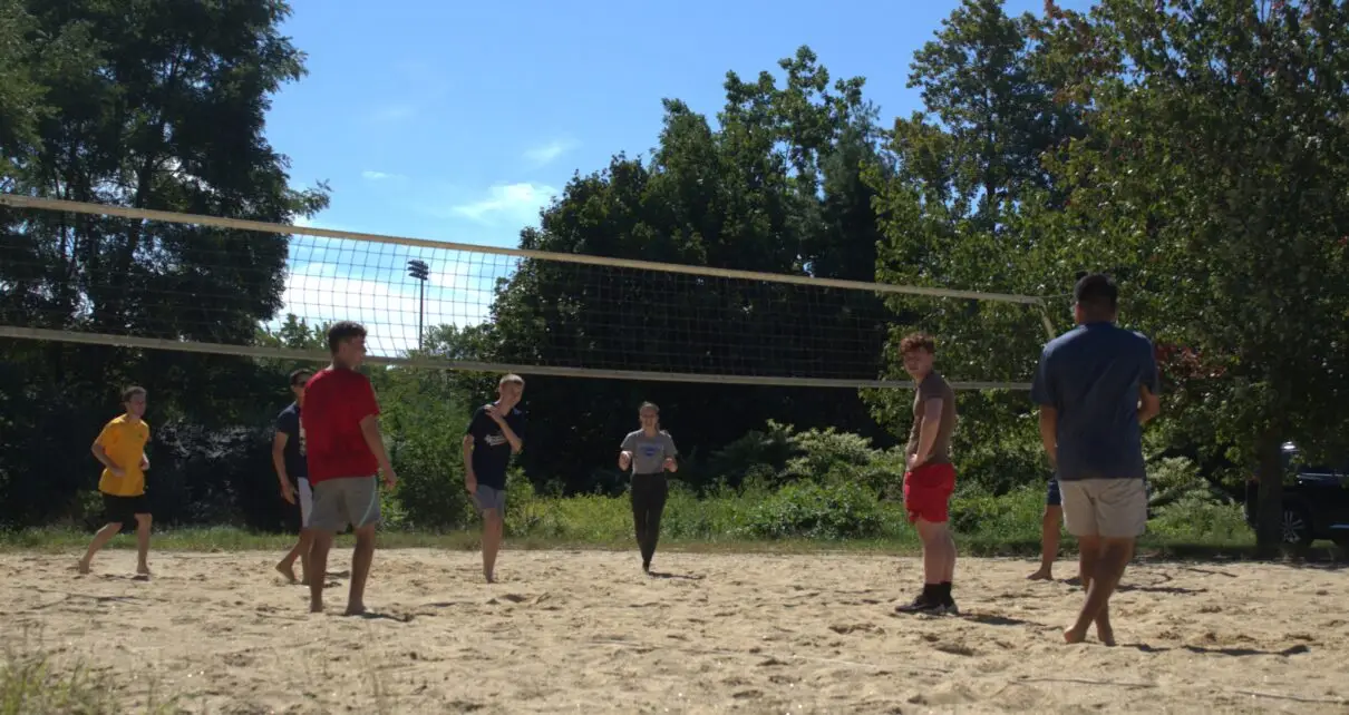 students playing volleyball